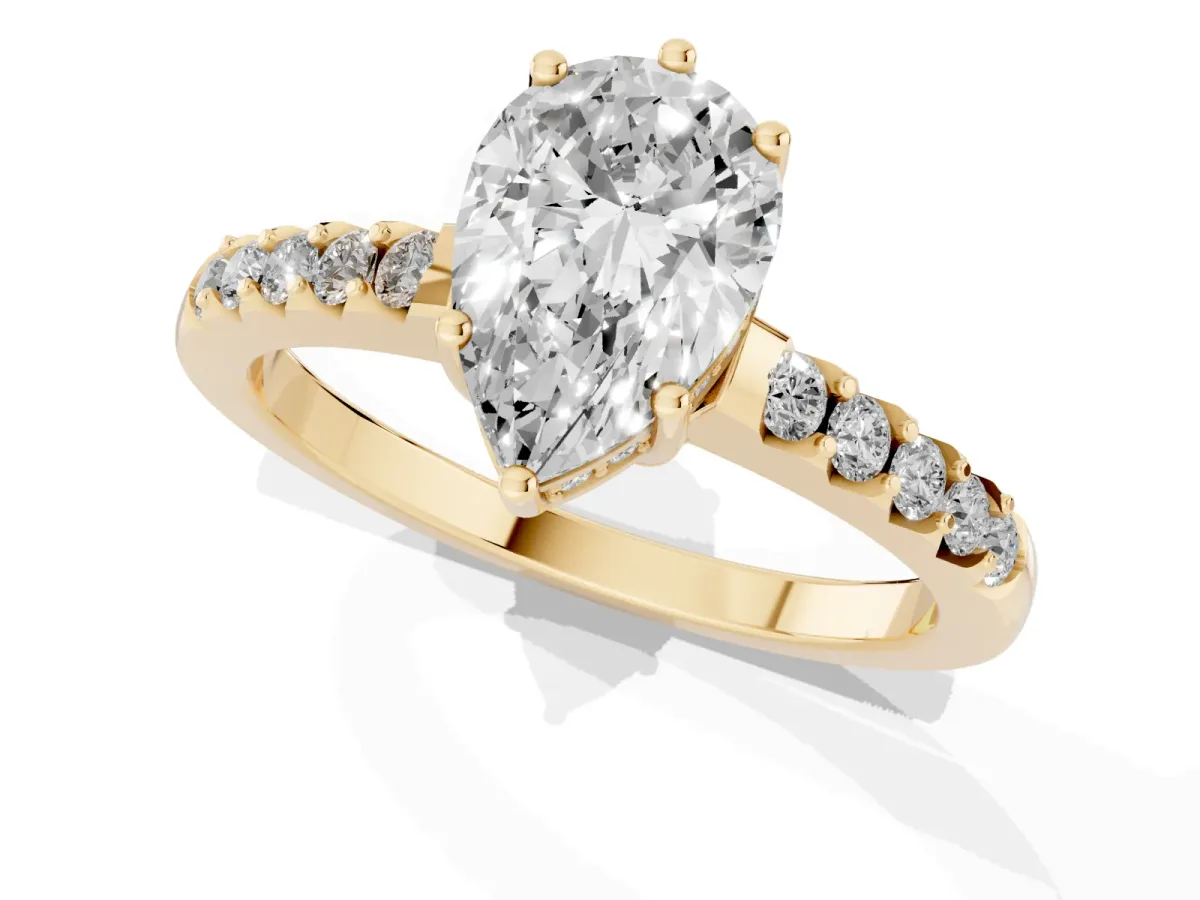 Pear Cut Solitaire Diamond Engagement Ring with Pavé Band and Six-Prong Setting Yellow gold