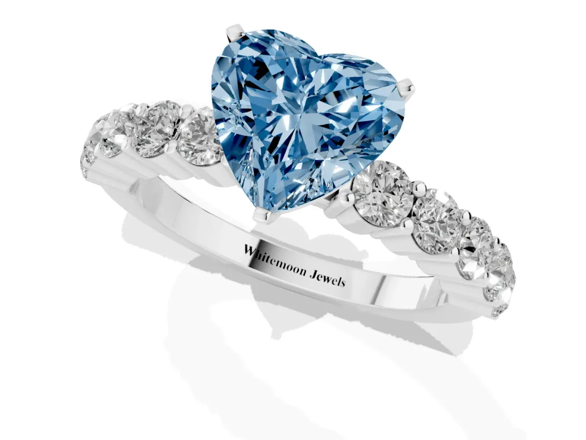 Fancy Blue Heart Cut Diamond Solitaire Ring with Shared Prong Round Side Stones White gold