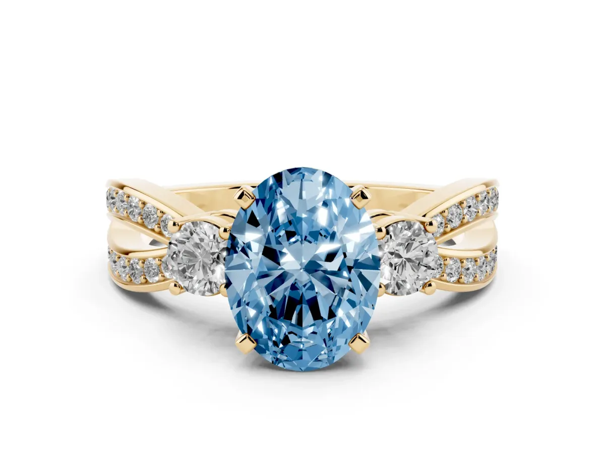Fancy Blue Three-Stone Oval Cut Cut Diamond Twist Band with Prong Setting Yellow gold