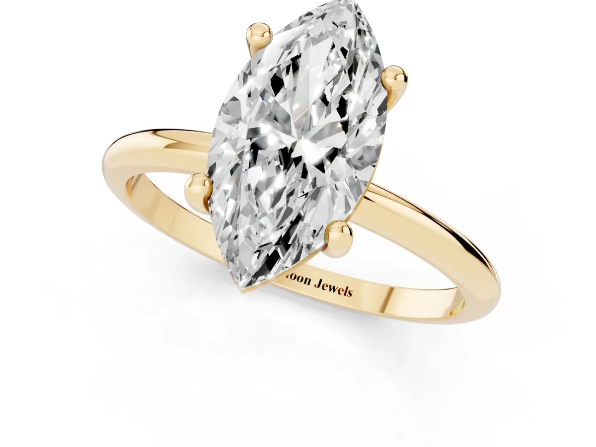 Marquise Cut Solitaire Diamond Ring with 4-Prong Setting on a Classic Band Yellow gold