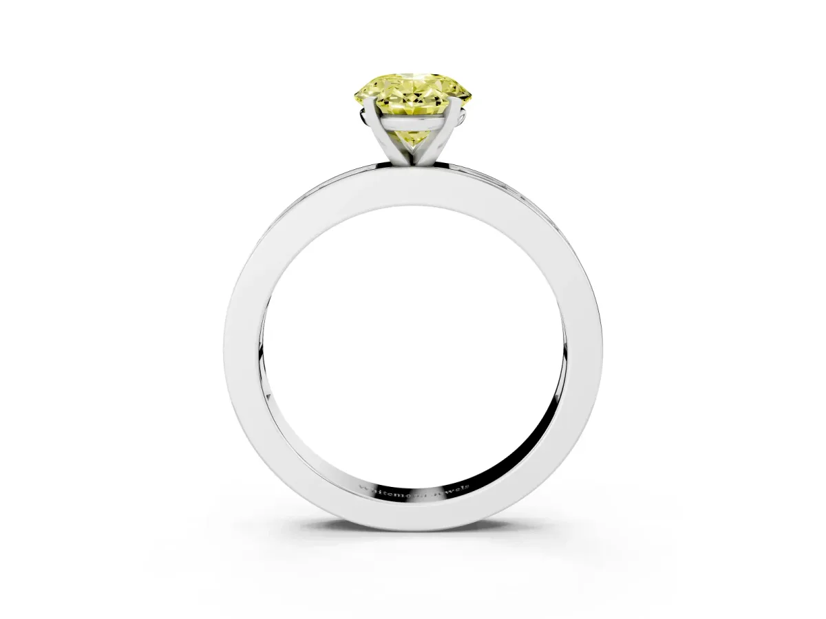 Fancy Yellow Oval Cut Solitaire Diamond Ring with Channel-Set Baguette Band and Four-Prong Setting Silver