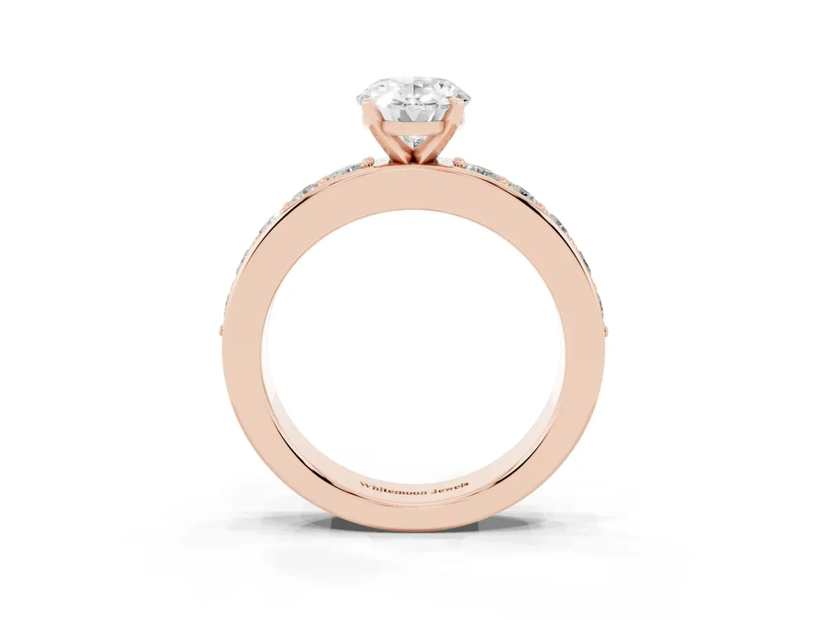 Oval Cut Diamond Engagement Ring with Channel Set Round Band and Prong Setting Rose gold