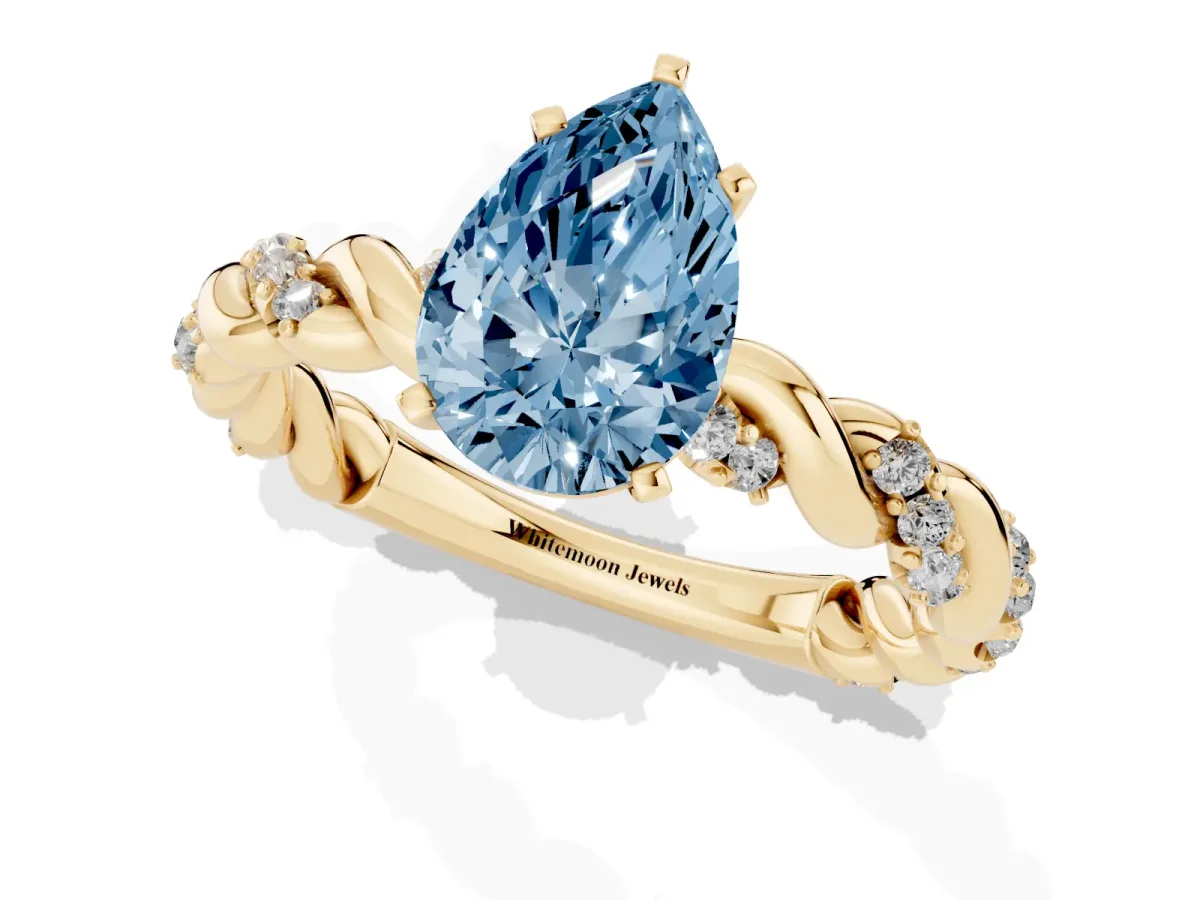 Fancy Blue Pear Cut Diamond Solitaire Ring with Twisted Band and Pavé Accents Yellow gold