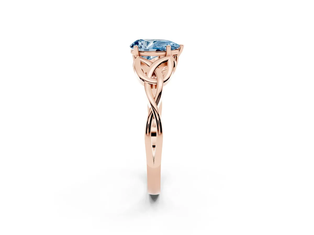 Fancy Blue Pear Cut Diamond Solitaire Engagement Ring with Celtic Knot Band and Four-Prong Setting Rose gold