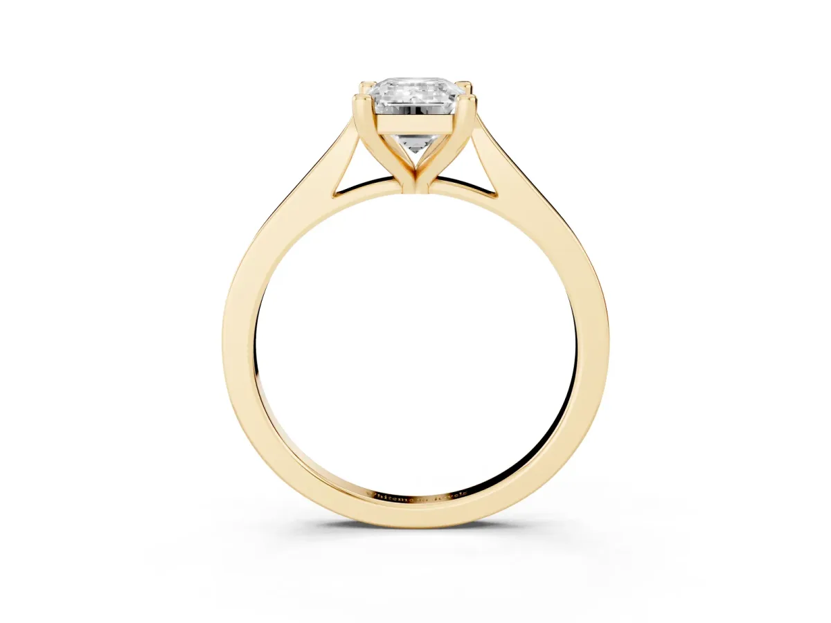 Emerald Cut Solitaire Diamond Ring with Four-Prong Setting and Tapered Band Yellow gold