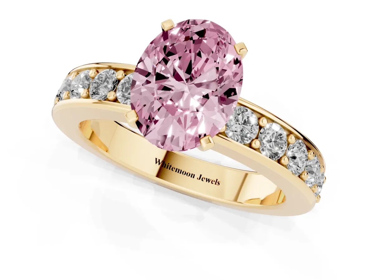 Fancy Pink Oval Cut Diamond Engagement Ring with Channel Set Round Band and Prong Setting Yellow gold