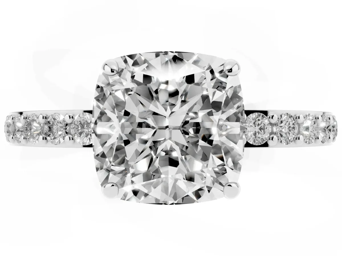 Cushion Cut Diamond Solitaire Engagement Ring with Pavé Band and Four-Prong Setting Silver