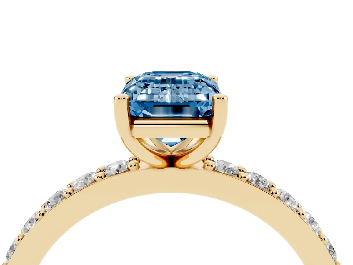 Fancy Blue Emerald Cut Cut Diamond Solitaire with Pave Band and Four-Prong Setting Yellow gold