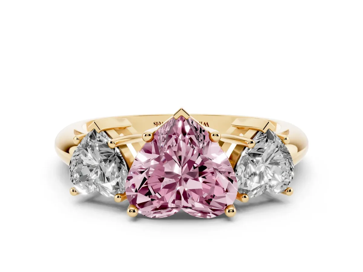Fancy Pink Three-Stone Heart Cut Cut Diamond Engagement Ring with Prong Setting on a White Gold Band Yellow gold