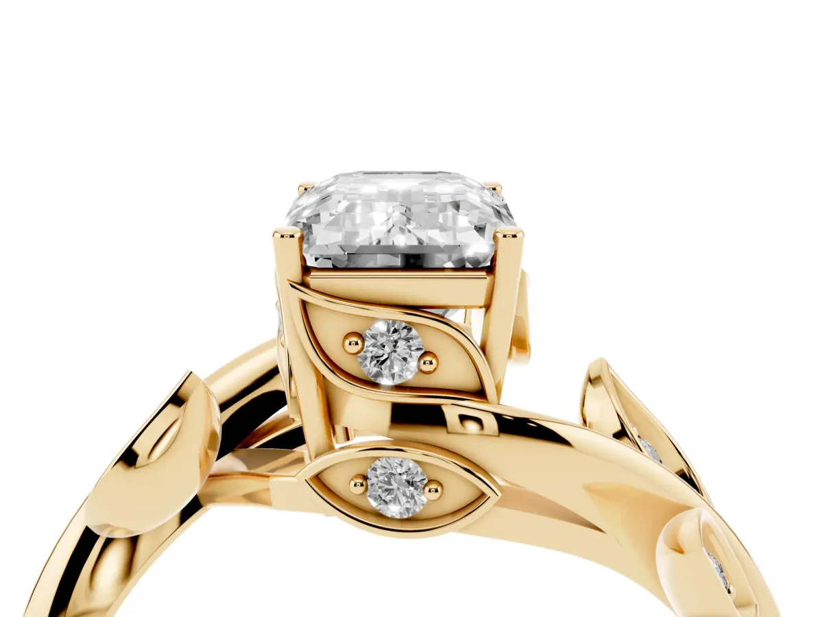 Emerald Cut Solitaire Twist Engagement Ring with Leaf Accents and Prong Setting Yellow gold