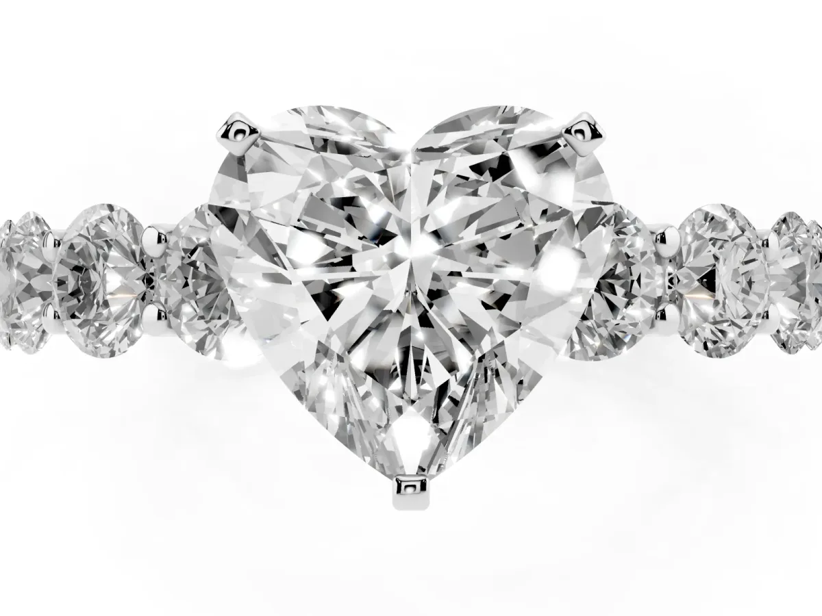 Heart Cut Diamond Prong Setting with Side Stones on a Pave Band Silver