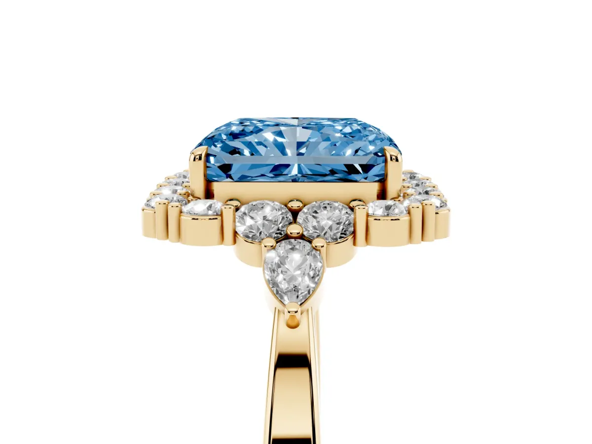 Fancy Blue Radiant Cut Diamond Halo Ring with Pear Side Stones and Prong Setting Yellow gold