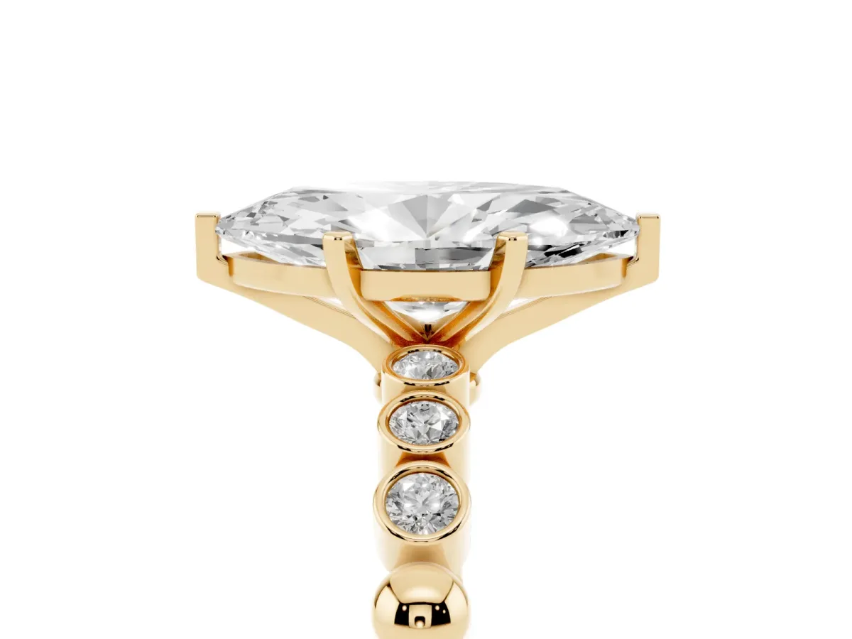 Marquise Cut Solitaire Bezel Accent Diamond Engagement Ring with Beaded Band and Four-Prong Setting Yellow gold