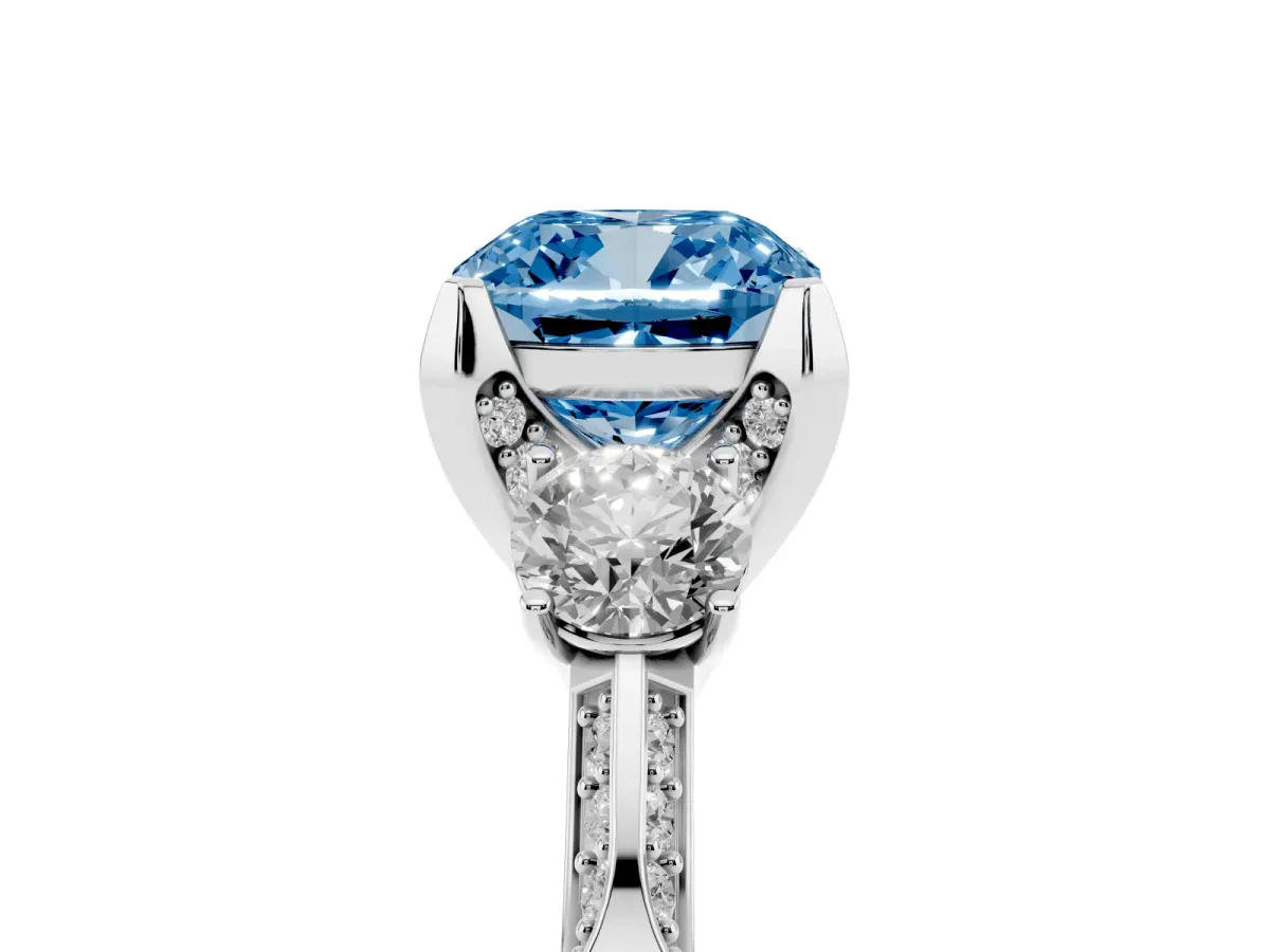 Fancy Blue Cushion Cut Brilliant Three-Stone Diamond Ring with Pavé Band and Four-Prong Setting White gold