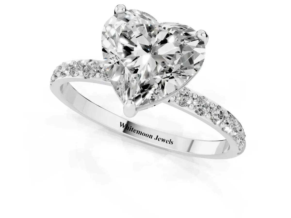 Heart Cut Diamond Solitaire Ring with Round Pavé Band and Prong Setting Silver