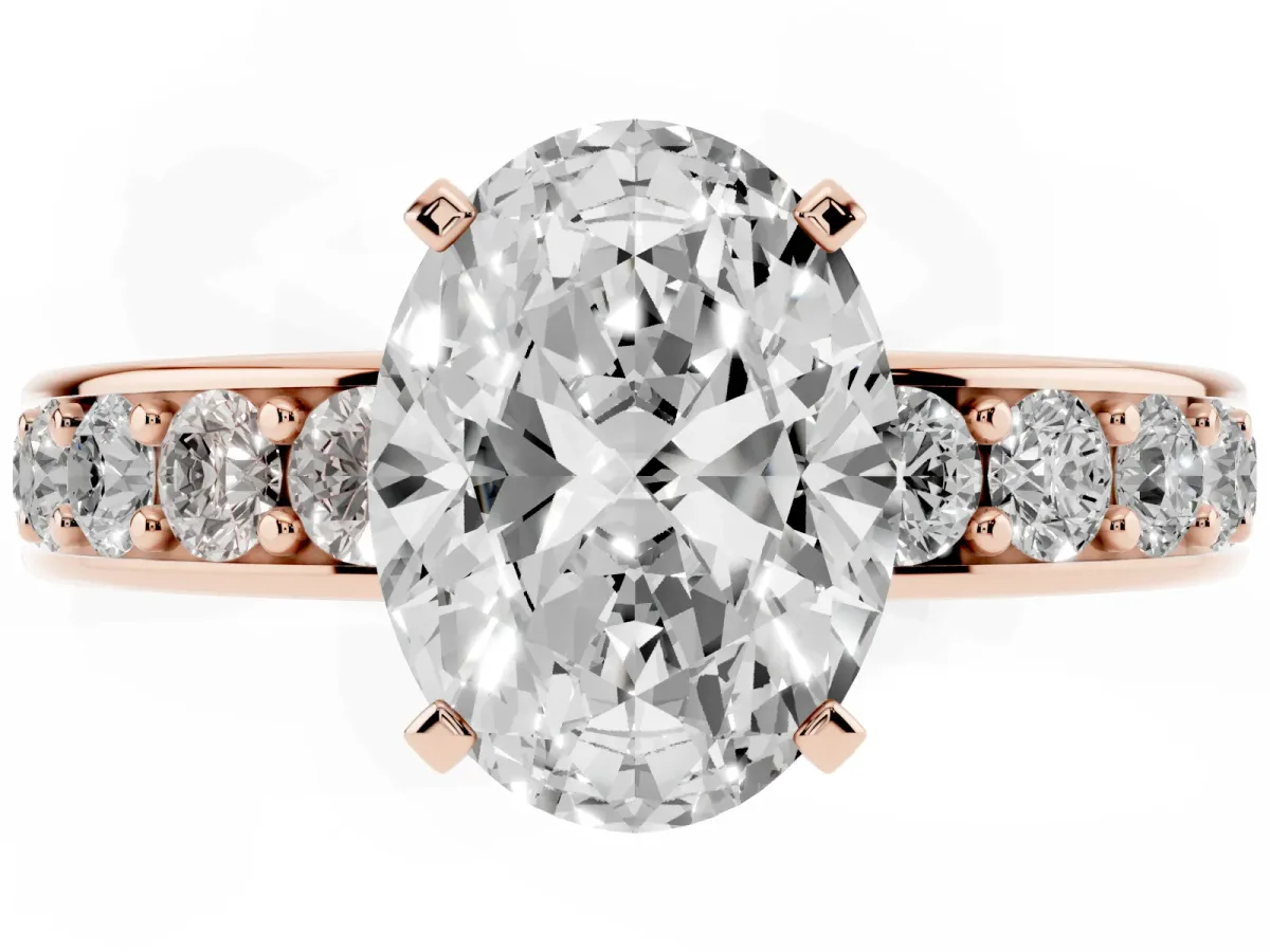 Oval Cut Diamond Engagement Ring with Channel Set Round Band and Prong Setting Rose gold