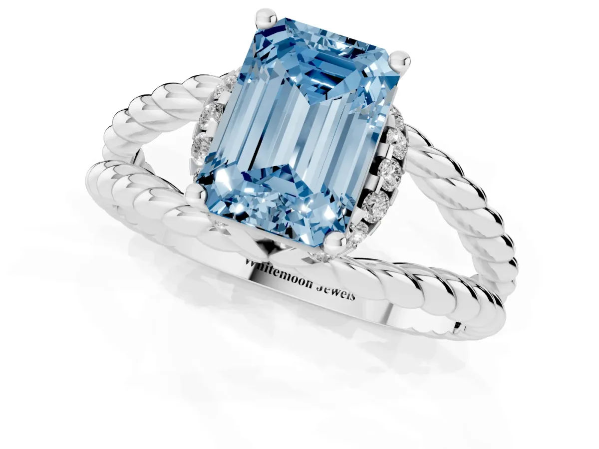 Fancy Blue Emerald Cut Halo Twisted Band Four-Prong Ring Silver
