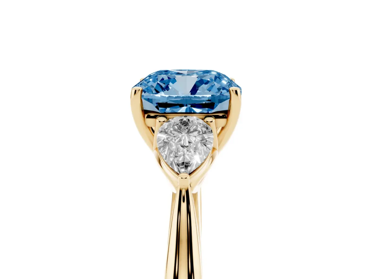 Fancy Blue Cushion Cut Diamond Three-Stone Ring with Pear Side Stones and Prong Setting Yellow gold