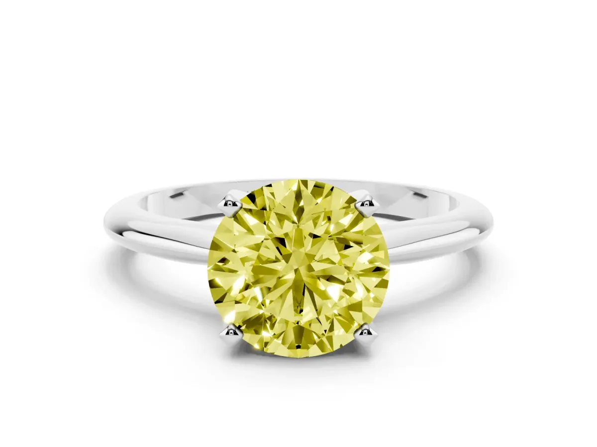 Fancy Yellow Round Cut Cut Solitaire Ring with Four-Prong Setting on a Classic Band Silver