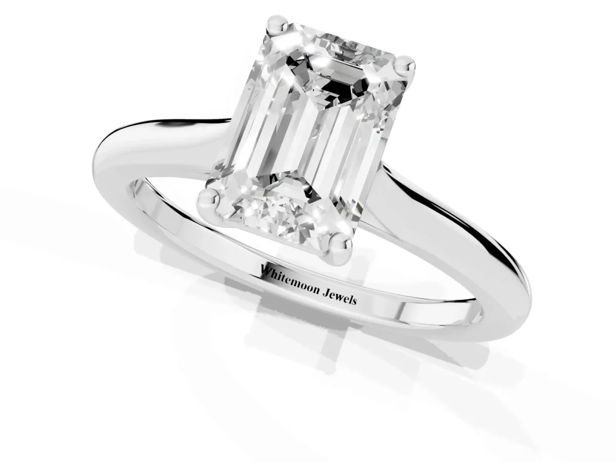 Emerald Cut Cut Solitaire Ring with Cathedral Band and Four-Prong Setting Silver