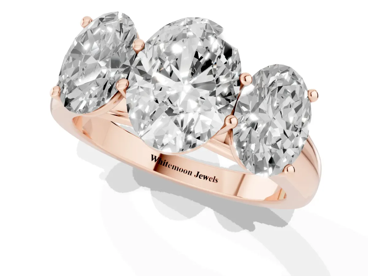 Oval Cut Three-Stone Diamond Ring with Prong Setting on a Classic Band Rose gold