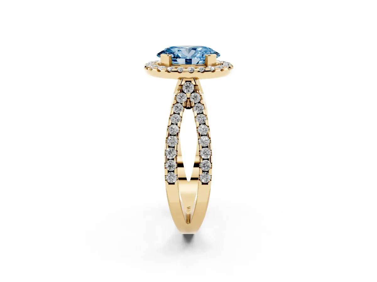 Fancy Blue Oval Cut Diamond Halo Ring with Split Shank Pavé Band and Prong Setting Yellow gold