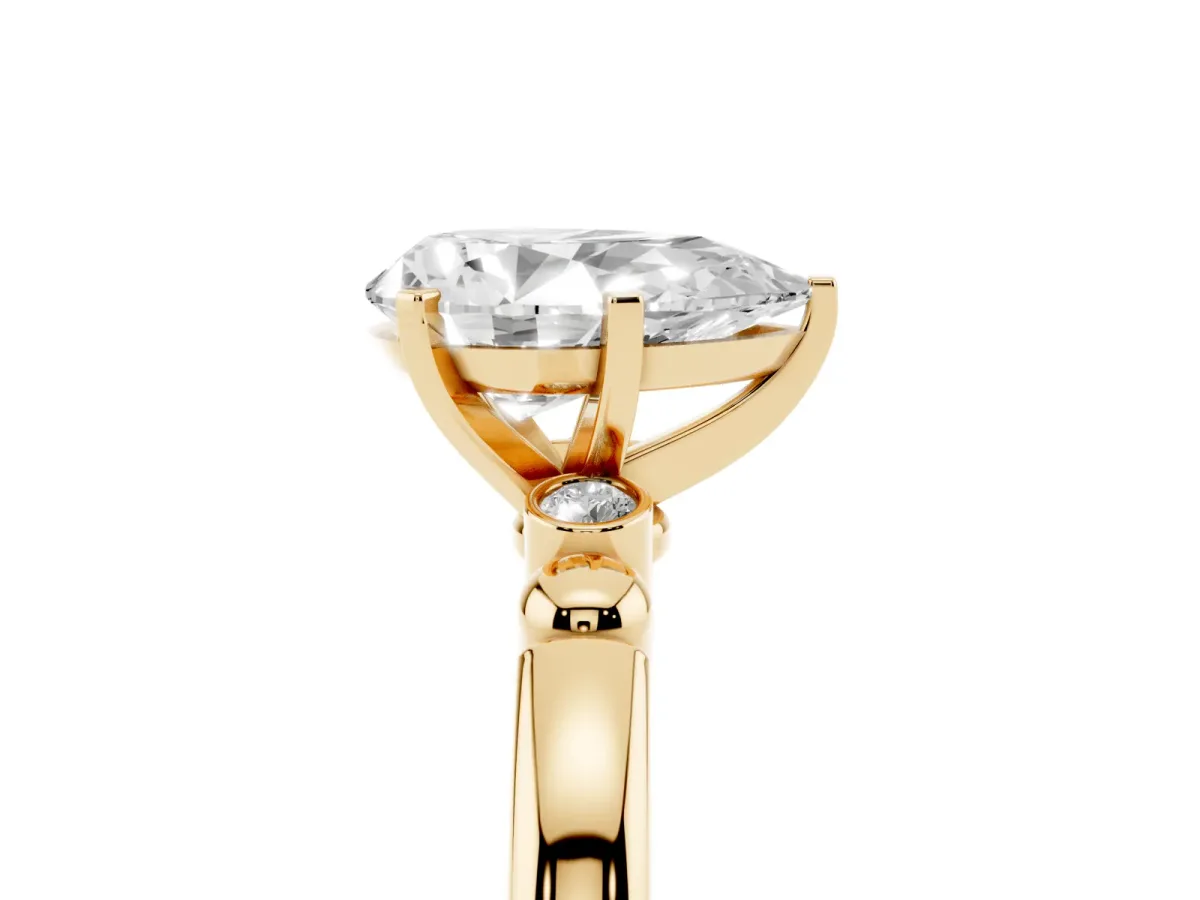 Pear Cut Solitaire Beaded Band with Four-Prong Setting Yellow gold