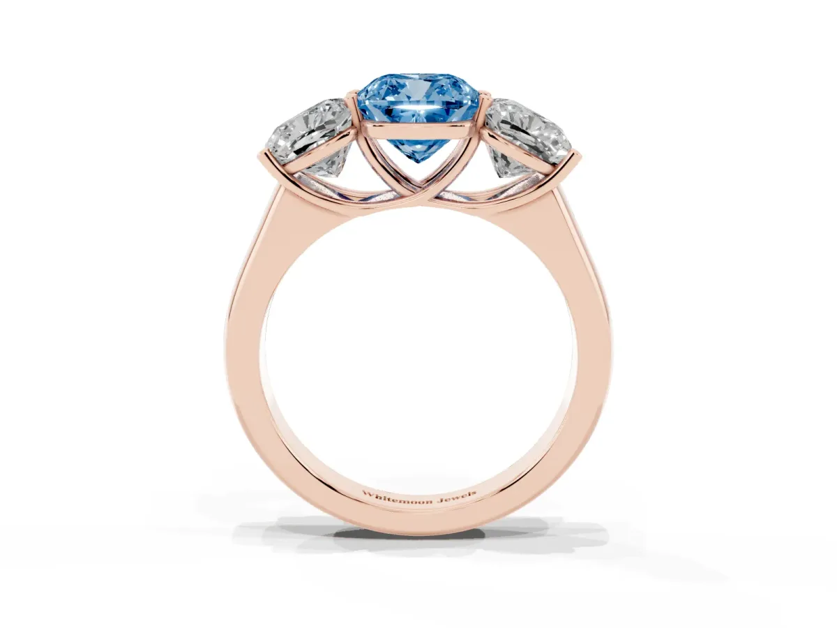 Fancy Blue Cushion Cut Three-Stone Diamond Ring with Prong Setting on a Classic Band Rose gold