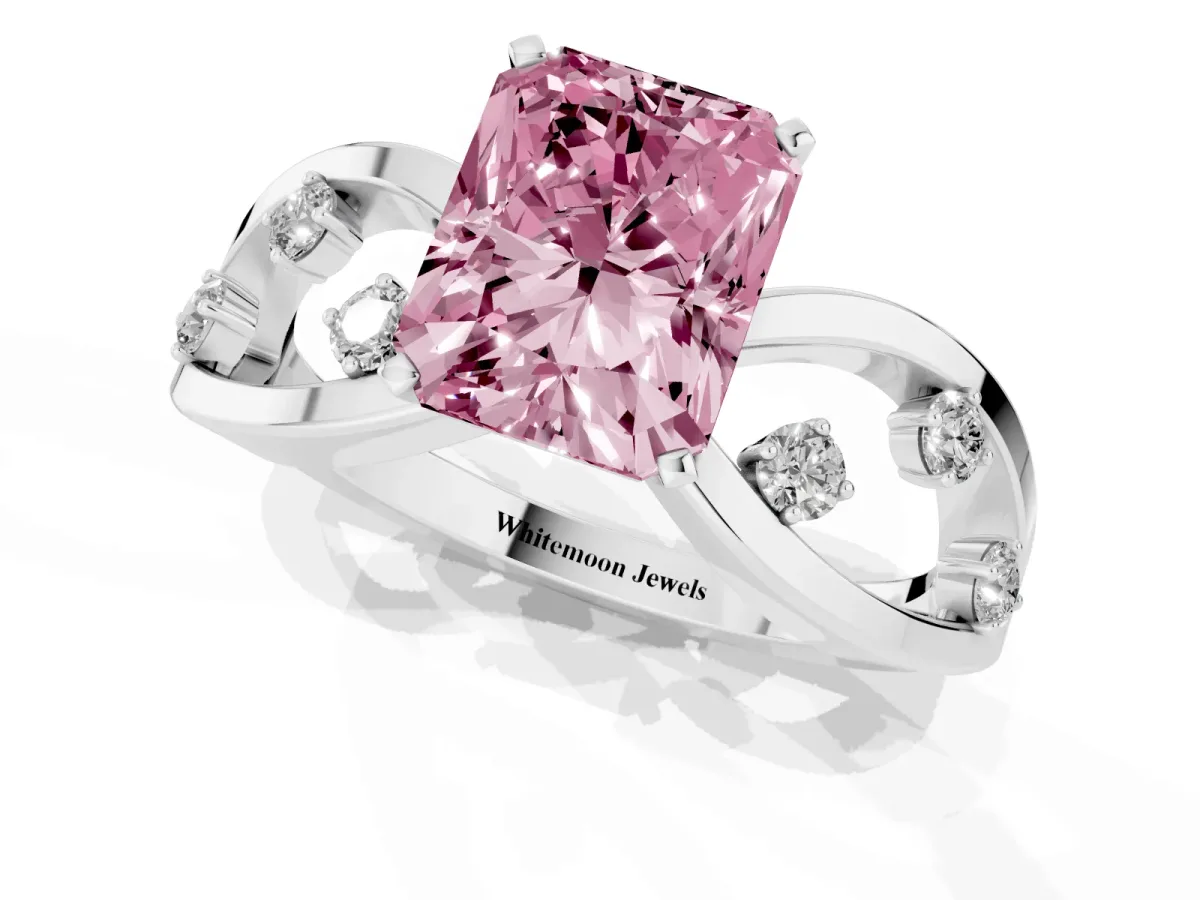 Fancy Pink Radiant Cut Cut Solitaire Diamond with Side Stones on Criss-Cross Band and Four-Prong Setting Platinum