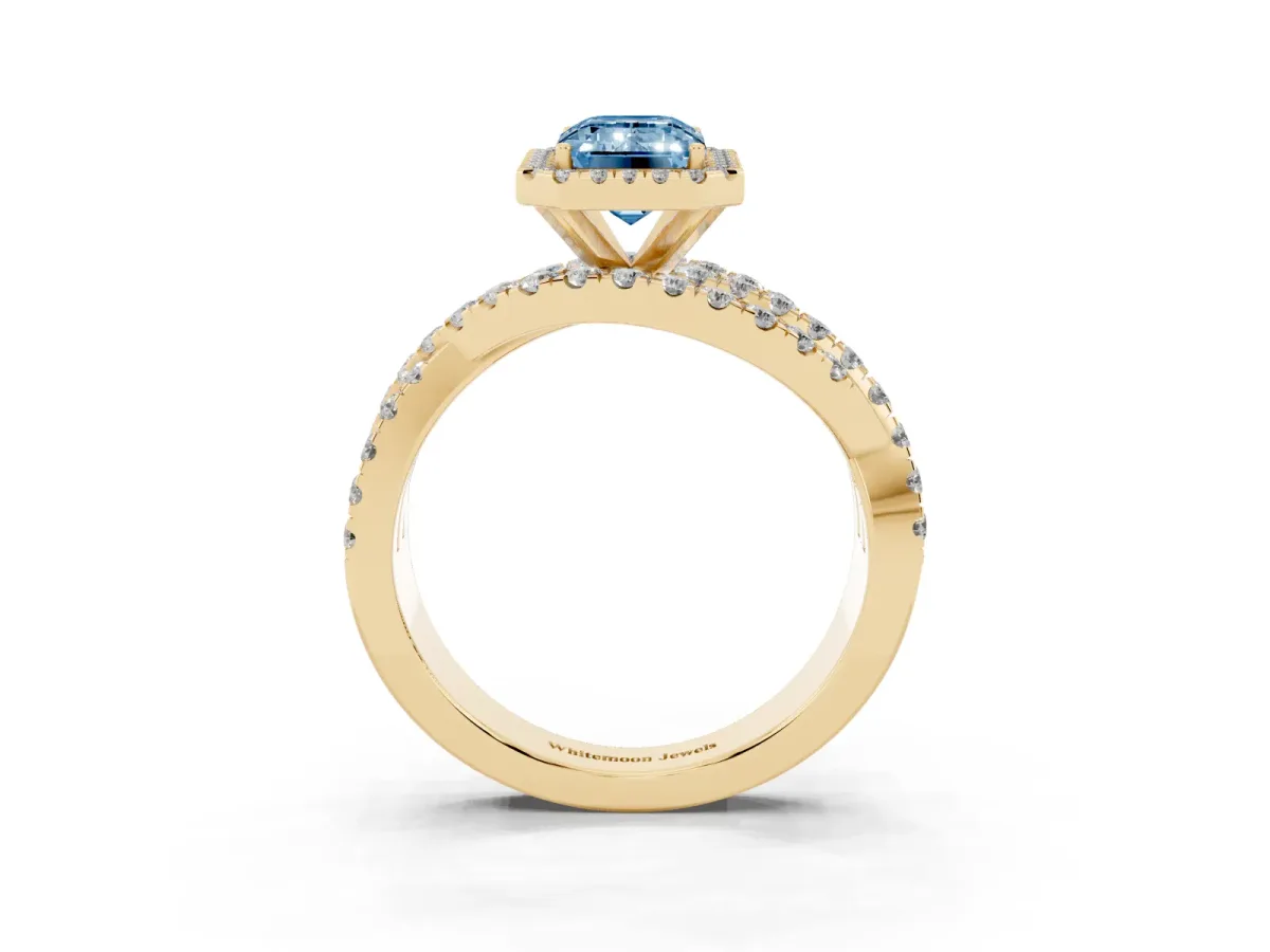 Fancy Blue Emerald Cut Diamond Halo Ring with Round Split Shank and Prong Setting Yellow gold