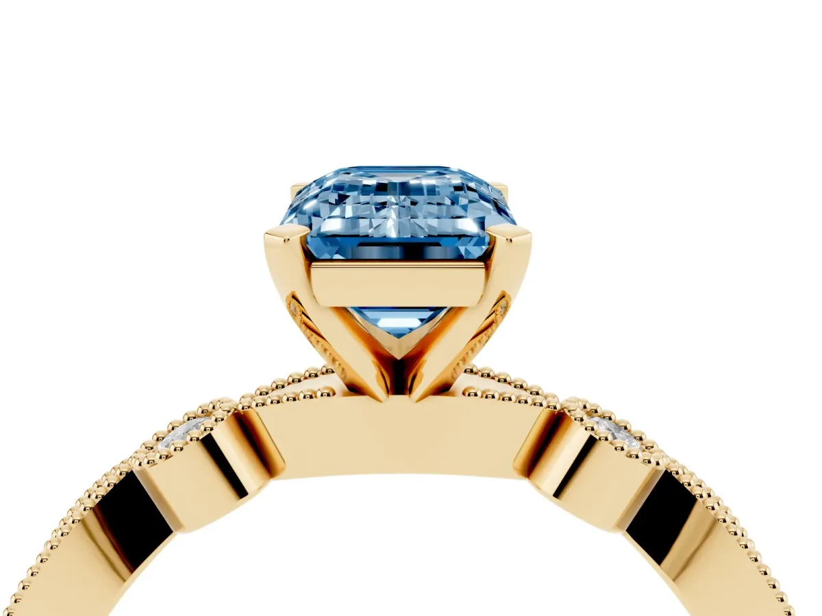Fancy Blue Emerald Cut Milgrain Bezel Diamond Engagement Ring with Solitaire Prong Setting Yellow gold