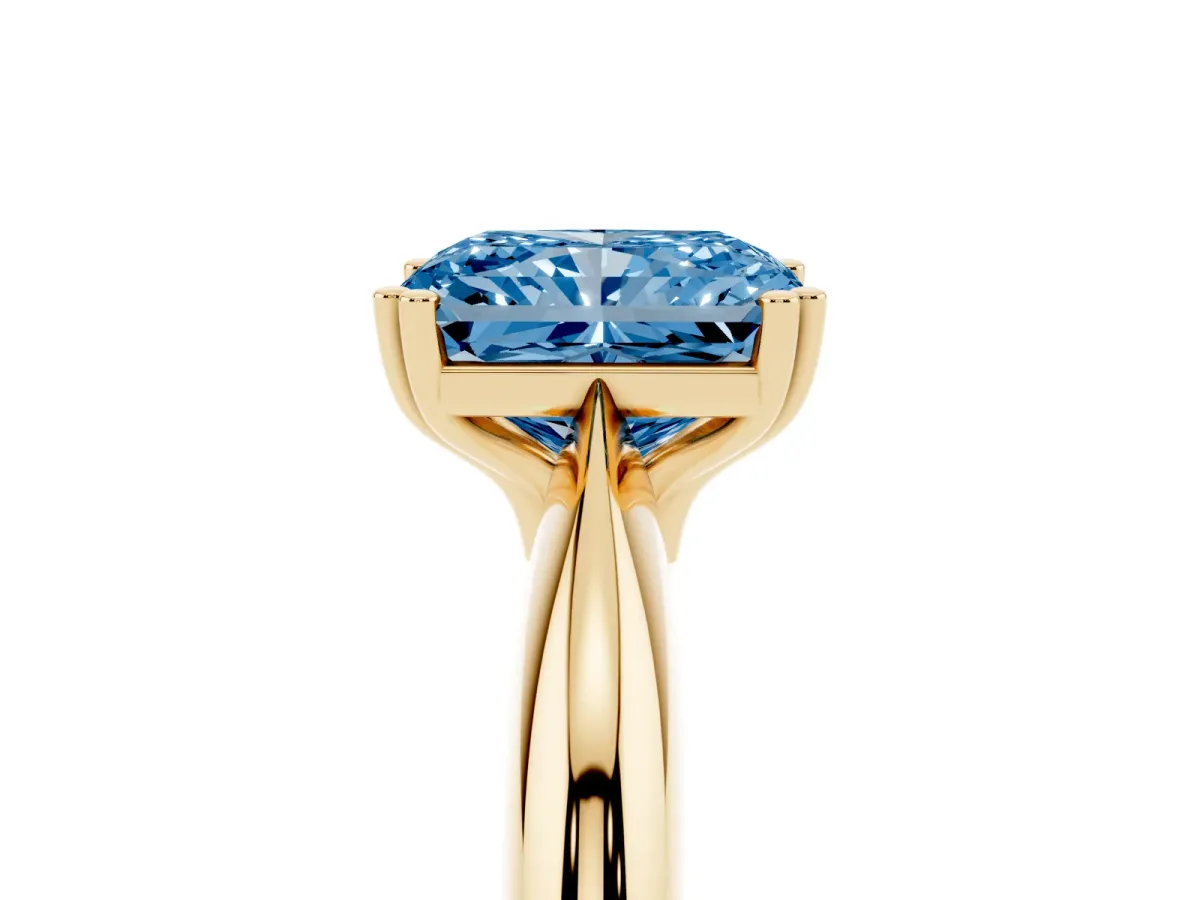 Fancy Blue Radiant Cut Cut Solitaire Engagement Ring with Tapered Band and Four-Prong Setting Yellow gold