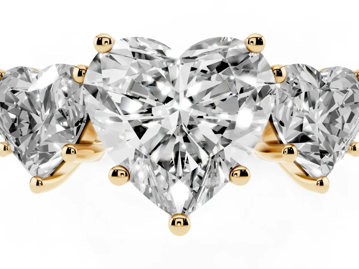 Three-Stone Heart Cut Diamond Ring with Round Pavé Band and Prong Setting Yellow gold