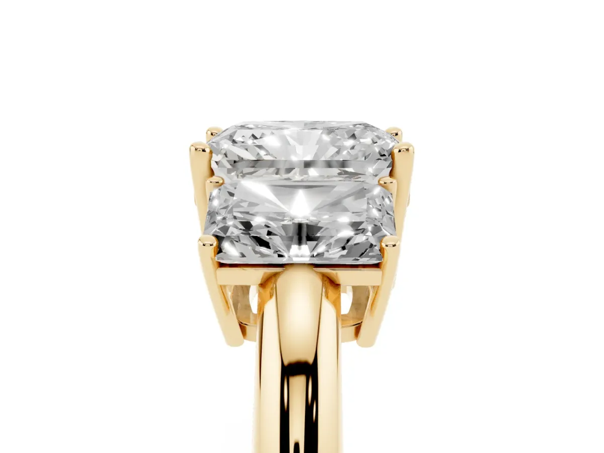 Three-Stone Radiant Cut Cut Diamond Engagement Ring with Prong Setting on a White Gold Band Yellow gold