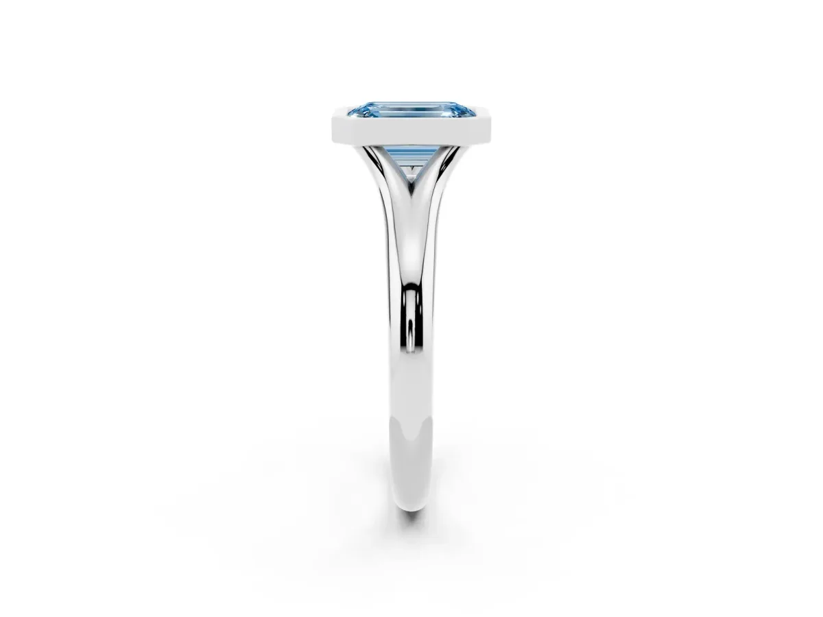 Fancy Blue Bezel Set Emerald Cut Solitaire Diamond Ring with Smooth Band Silver