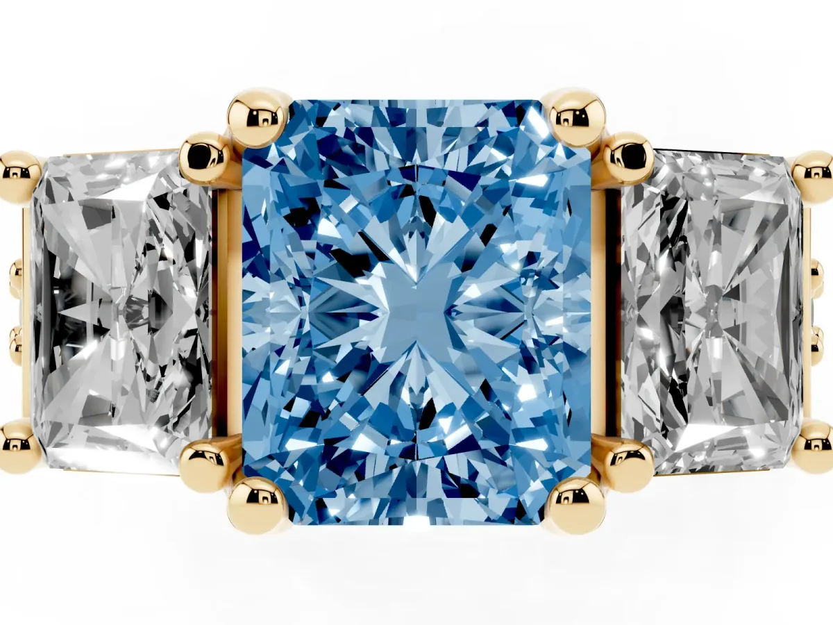 Fancy Blue Radiant Cut Diamond Three-Stone Ring with Channel Set Band and Four-Prong Setting Yellow gold