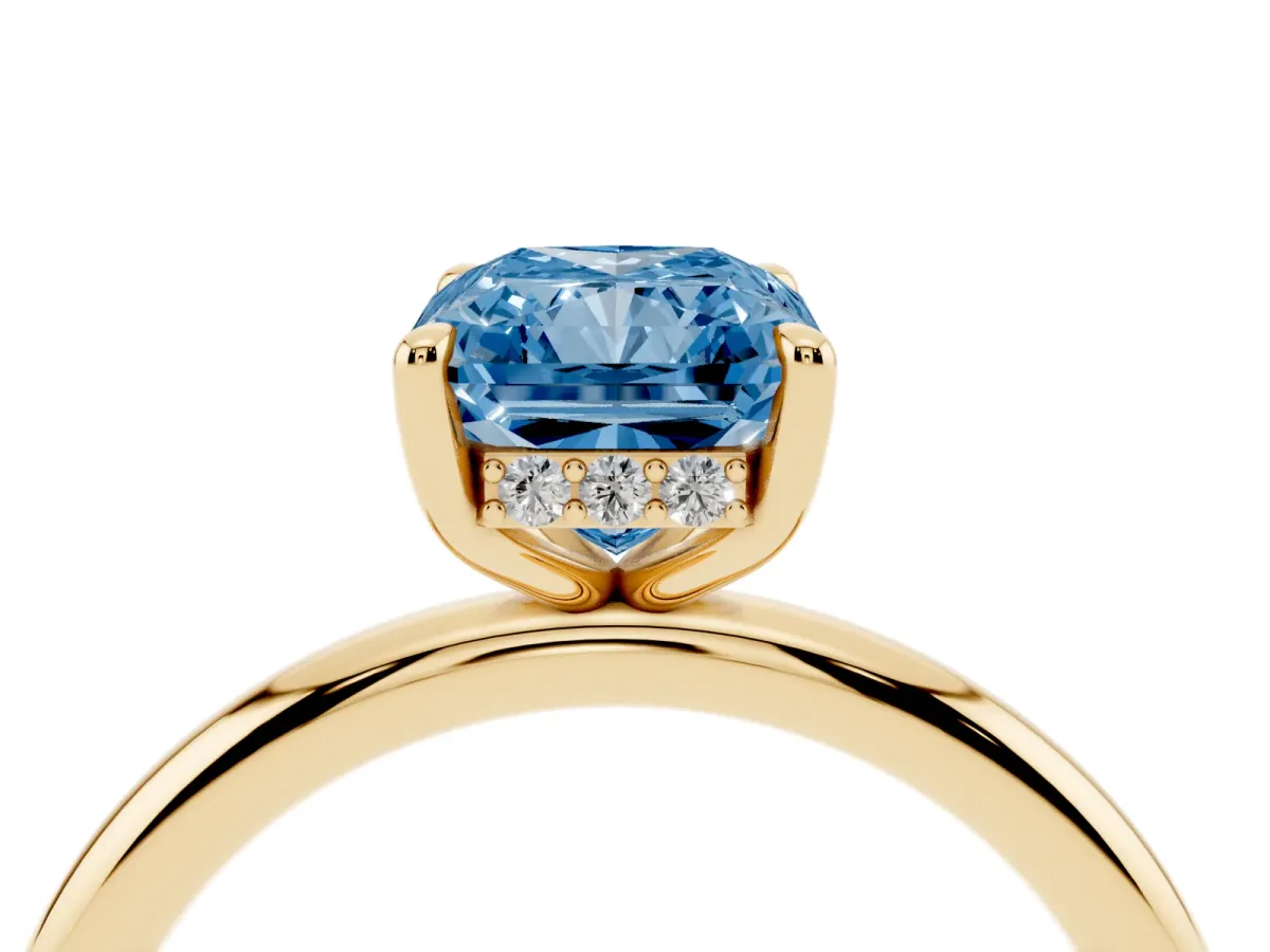 Fancy Blue Radiant Cut Diamond Solitaire Ring with Thin Band and Four-Prong Setting Yellow gold