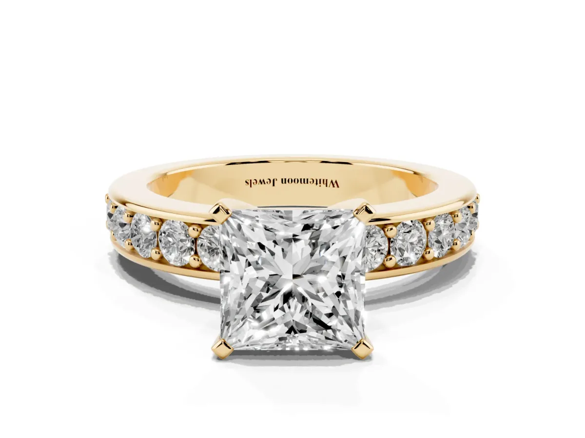 Princess Cut Diamond Engagement Ring with Channel Set Round Band and Prong Setting Yellow gold