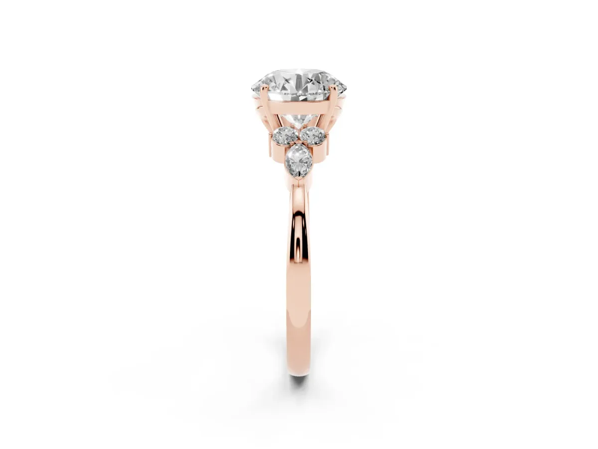 Round Cut Brilliant Diamond Solitaire Ring with Pear Side Stones and Four-Prong Setting Rose gold