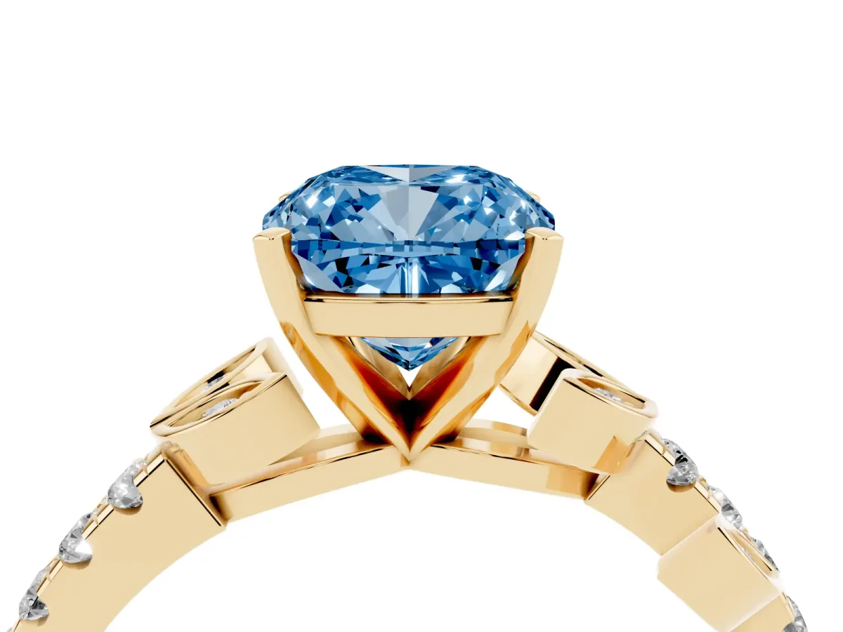 Fancy Blue Cushion Cut Solitaire Leaf-Inspired Diamond Ring with Pavé Band and Four-Prong Setting Yellow gold
