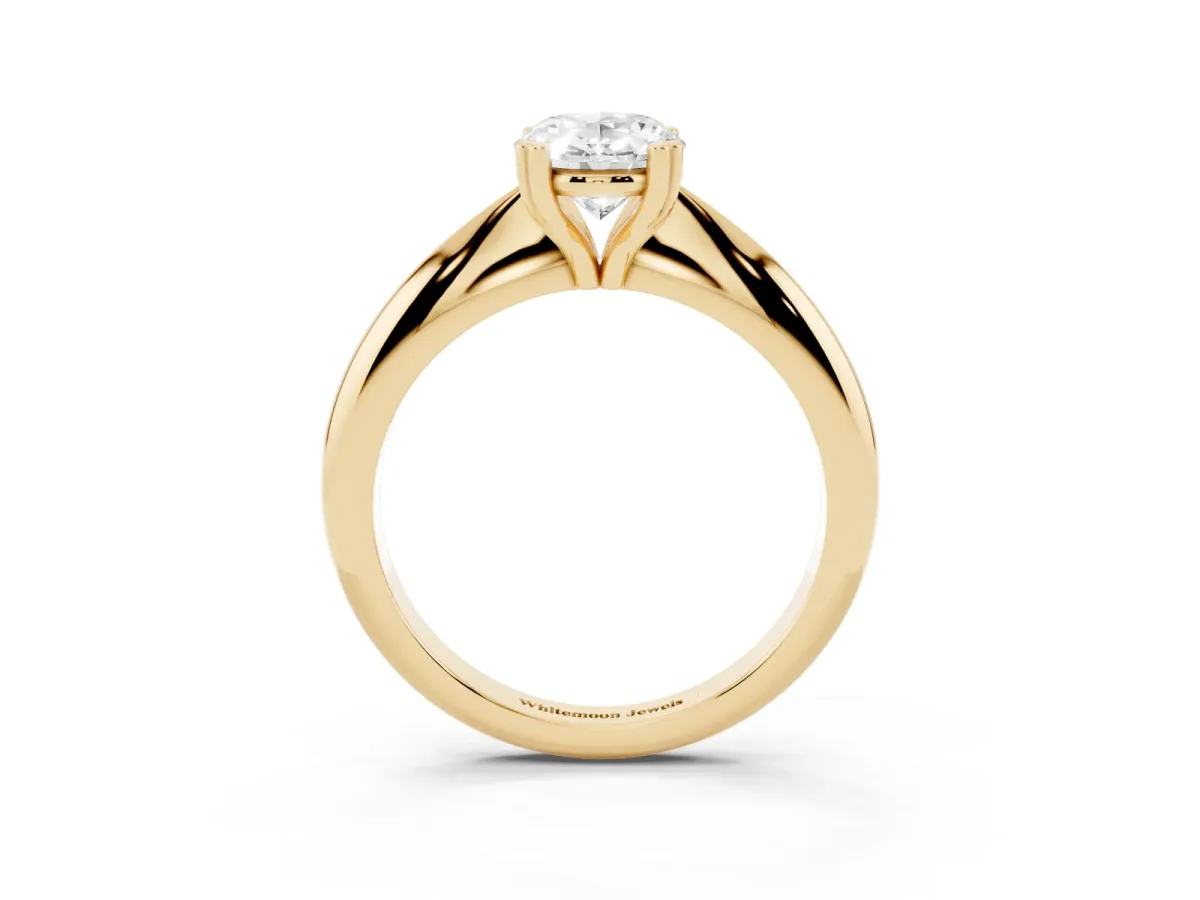 Oval Cut Cut Solitaire Engagement Ring with Tapered Band and Four-Prong Setting Yellow gold
