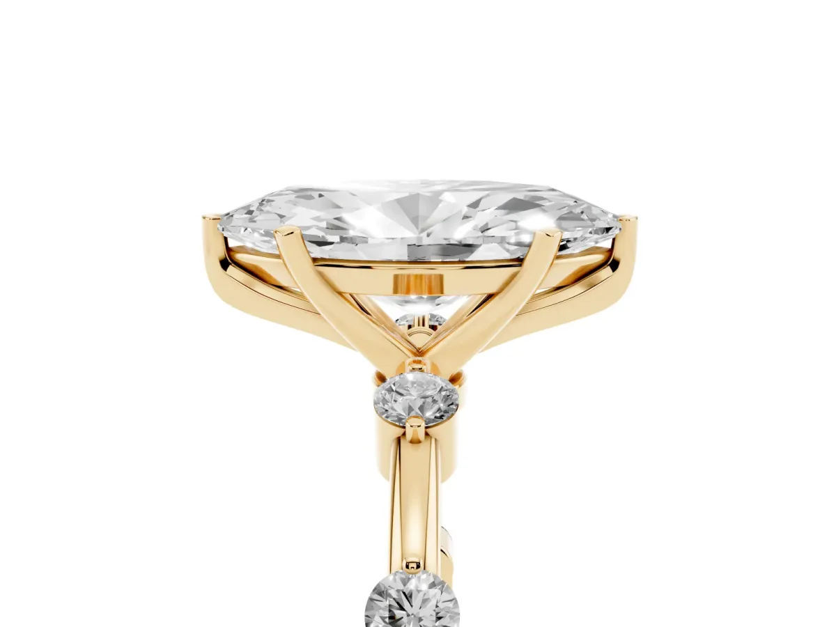Marquise Cut Solitaire Diamond Ring with Bezel Set Side Stones and Prong Setting Yellow gold