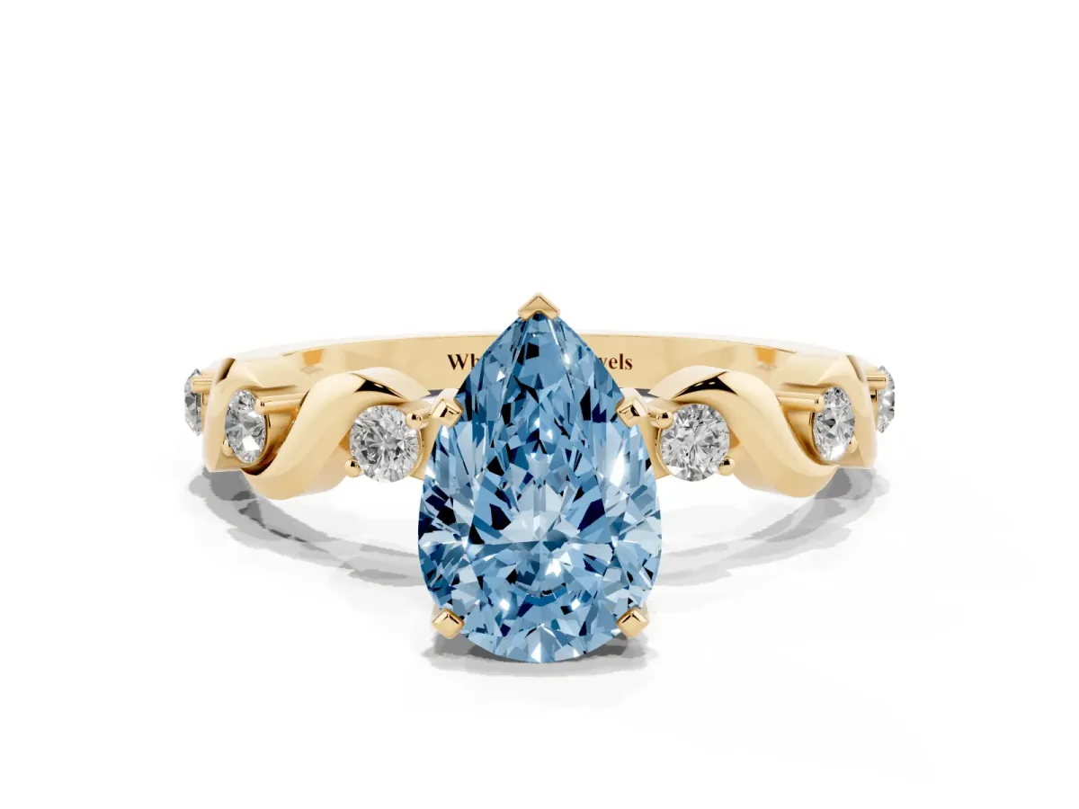 Fancy Blue Pear Cut Diamond Solitaire Twisted Band with Round Accents and Prong Setting Yellow gold