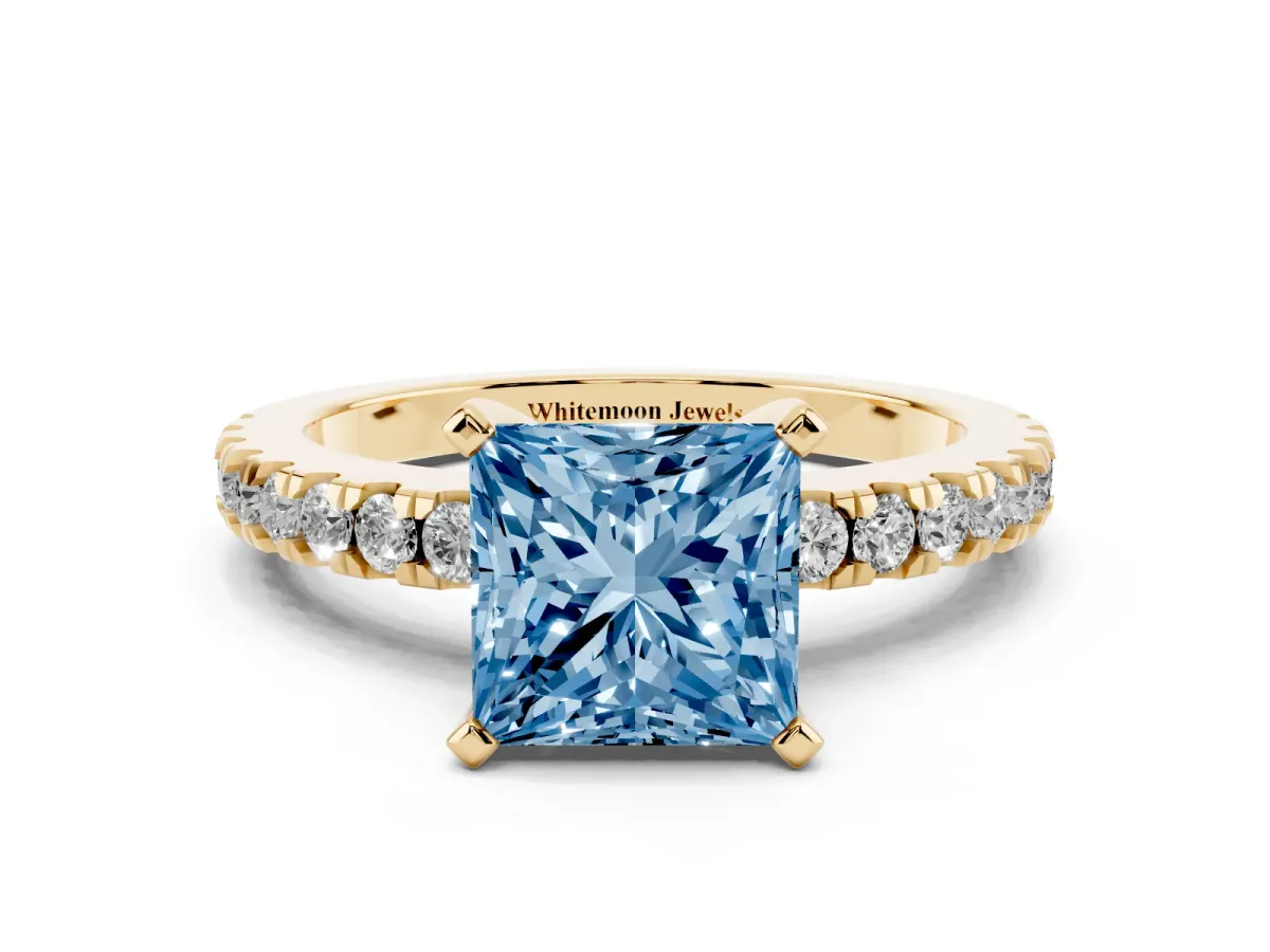 Fancy Blue Princess Cut Solitaire Diamond with Pavé Band and Four-Prong Setting Yellow gold