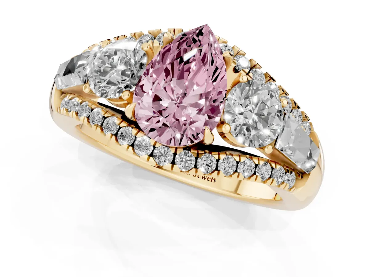 Fancy Pink Three-Stone Pear Cut Diamond Engagement Ring with Pave Band and Prong Setting Yellow gold