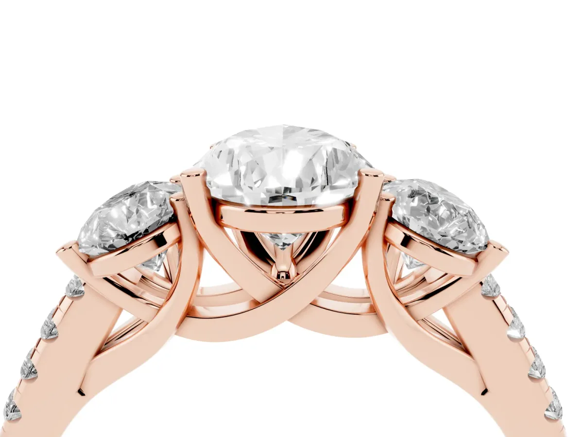 Three-Stone Pear Cut Diamond Ring with Round Pavé Band and Prong Setting Rose gold