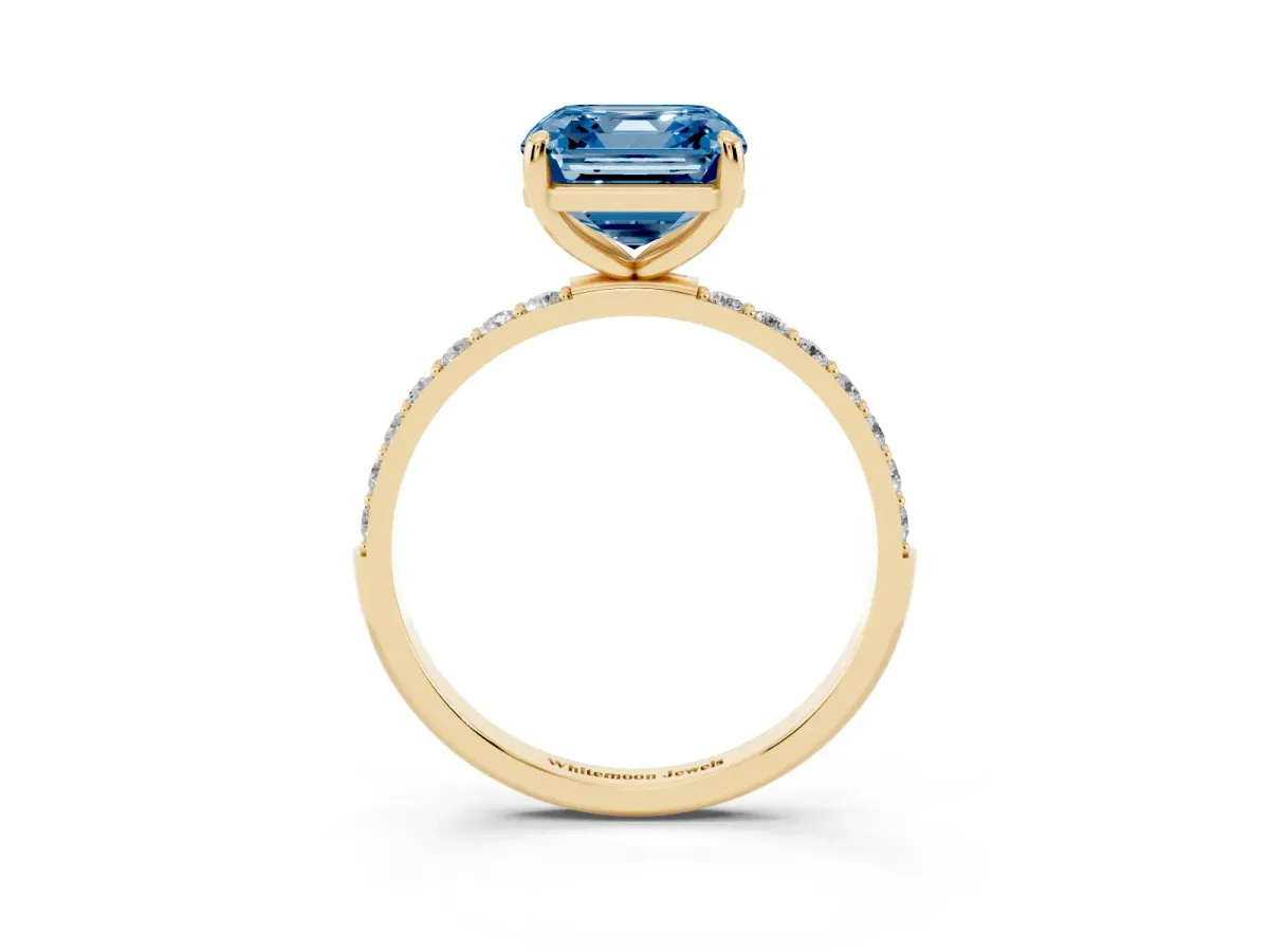 Fancy Blue Asscher Cut Diamond Solitaire Ring with Round Pavé Band and Prong Setting Yellow gold