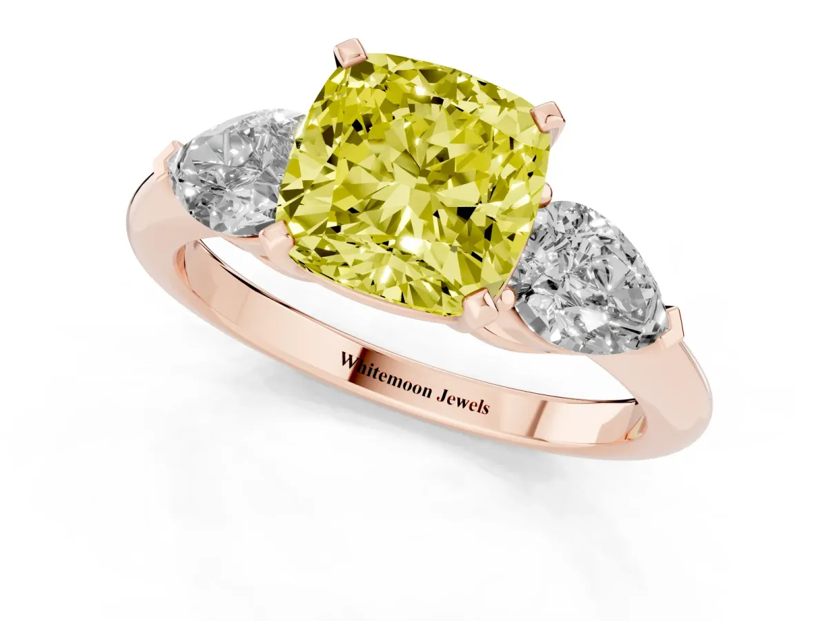 Fancy Yellow Three-Stone Cushion Cut Diamond Ring with Pear Side Stones and Four-Prong Setting Rose gold