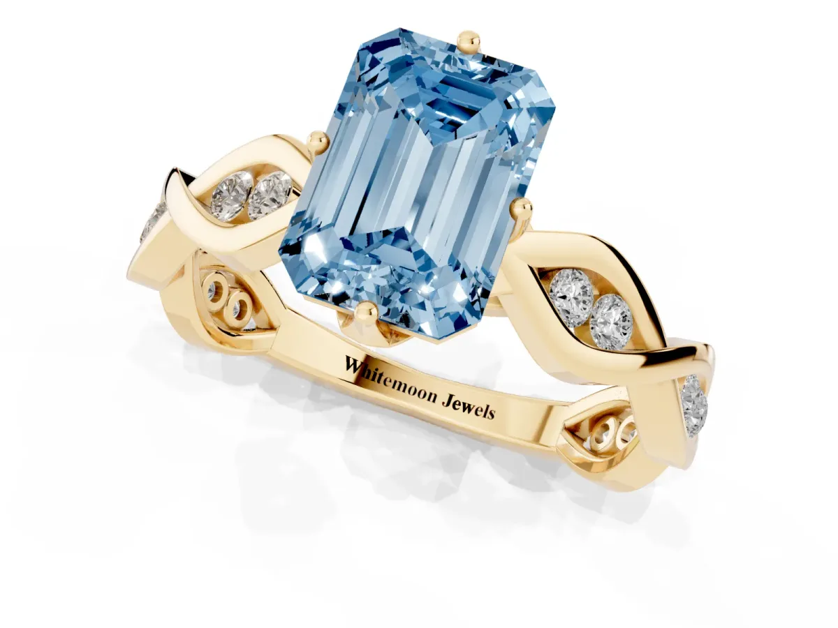 Fancy Blue Emerald Cut Solitaire Twist Band with Leaf Prong Setting Yellow gold