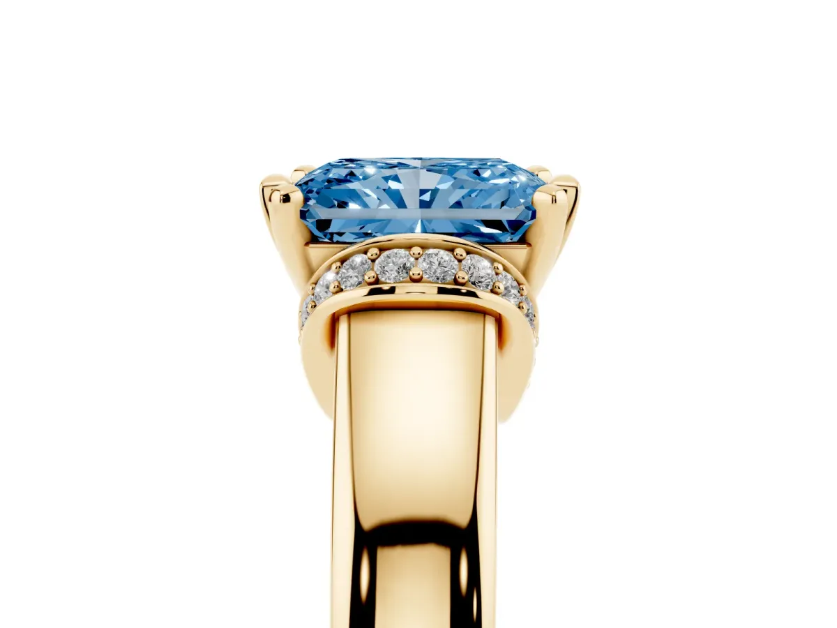 Fancy Blue Radiant Cut Solitaire Diamond Ring with Pave Band and Six-Prong Setting Yellow gold